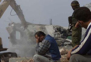 A-Palestinian-man-cant-look-as-his-home-is-demolished1
